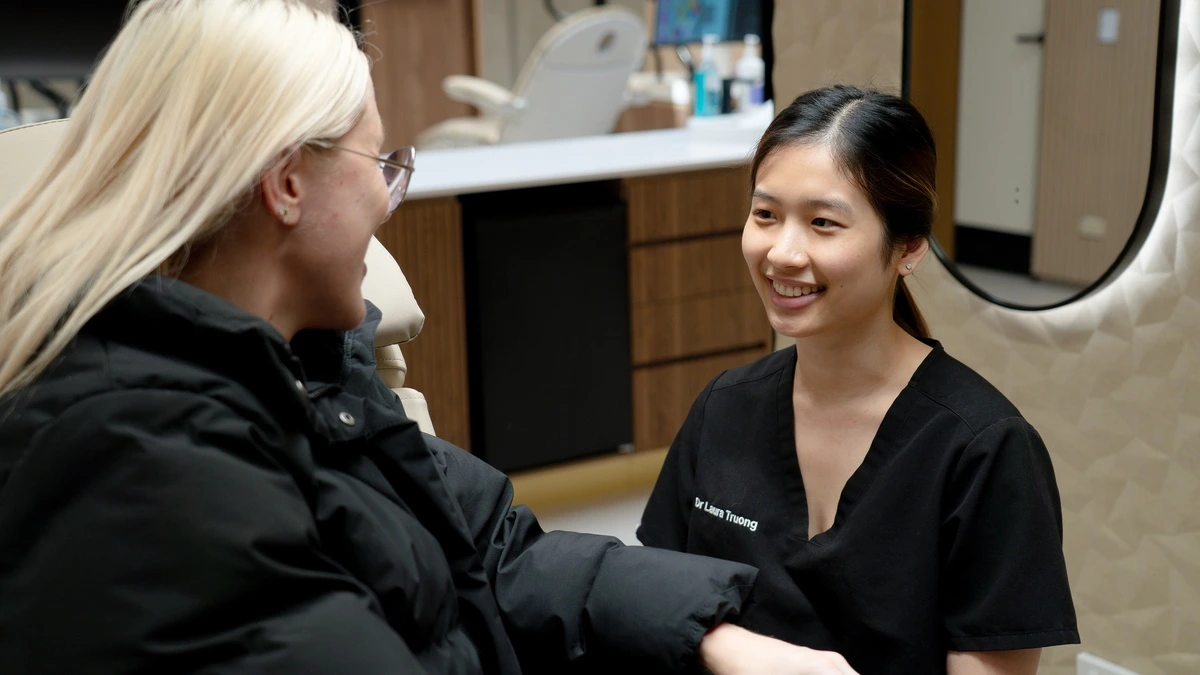 A Medland Orthodontics specialist with a patient A Medland Orthodontics specialist with a patient