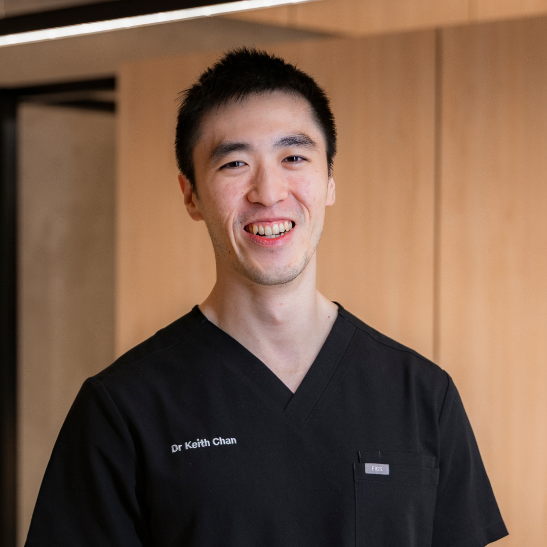 Orthodontist, Dr Keith Chan, of Medland Orthodontics smiling warmly towards the camera at the new Upper Coomera practice, located at 15 City Centre Drive, Upper Coomera QLD 4209.
